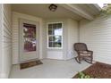 Cozy front porch featuring a rocking chair, decorative rug, and ample natural light at 975 Atir Ln, Greenfield, IN 46140