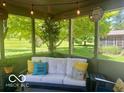 Cozy sunroom with comfortable seating and scenic views of the surrounding landscape at 10501 Greenway Dr, Fishers, IN 46037