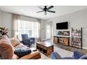 Inviting living room featuring hardwood floors, a large window, and comfortable seating at 158 Handley St, Indianapolis, IN 46222