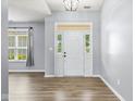 Bright foyer features a glass front door and sidelights, flooding the space with natural light at 1854 Oconnor Ct, Avon, IN 46123