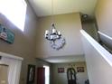 Inviting foyer features soaring ceilings, modern chandelier, and an open view to the living spaces at 2628 Newaygo Dr, Indianapolis, IN 46217