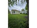 Spacious backyard, partially overgrown, offering great potential for outdoor activities and landscaping at 3305 E 30Th St, Indianapolis, IN 46218