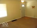 Bright living room featuring large window and neutral paint palette at 4830 Wentworth Blvd, Indianapolis, IN 46201