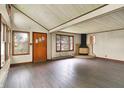 Bright living area with wood floors, fireplace, and natural light from large windows at 6580 N Us Highway 31, Whiteland, IN 46184
