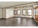 Spacious living room with wood floors and bright natural light coming through ample windows at 6580 N Us Highway 31, Whiteland, IN 46184