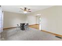 Bright dining area with a ceiling fan and access to additional living space at 823 W 200 N, Greenfield, IN 46140
