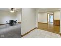 A view of the dining room and open floorplan with fresh paint, and new floors at 823 W 200 N, Greenfield, IN 46140