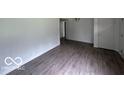 Spacious living room featuring laminate flooring and neutral paint at 907 Monroe St, Indianapolis, IN 46229
