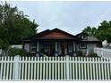 Charming home with a white picket fence and well-maintained landscaping at 9527 Pepperidge Dr, Indianapolis, IN 46235