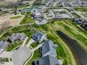 Aerial view showcasing the community's clubhouse, golf course, and surrounding homes at 987 Oak Terrace Rd, Westfield, IN 46074