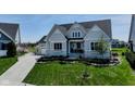 Charming two-story home with a well-kept lawn and inviting front entrance at 987 Oak Terrace Rd, Westfield, IN 46074