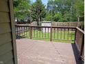 A wooden deck offers a scenic view of the backyard at 1008 E 61St St, Indianapolis, IN 46220