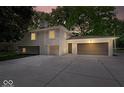 Well-maintained home with an attached two-car garage and spacious driveway for ample parking at 11123 Haverstick Rd, Carmel, IN 46033