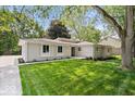 Well-maintained single-story home with a neatly manicured lawn and inviting curb appeal at 11123 Haverstick Rd, Carmel, IN 46033