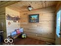 Cozy entryway with beautiful wood paneling, decor, and a charming bench at 11898 N 200 W, Fountaintown, IN 46130