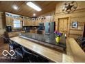 Large kitchen with custom wood cabinets, granite countertops, and a large island at 11898 N 200 W, Fountaintown, IN 46130
