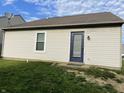 A view of the rear exterior of the home, featuring a door and window at 1420 Wigwam Ln, Martinsville, IN 46151