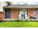 Cozy front porch featuring comfortable seating, decorative accents, and a welcoming brick facade at 1440 Fenwick Ave, Indianapolis, IN 46219