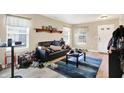 Cozy living room featuring ample natural light, neutral walls, and stylish decor accents at 15264 Ten Point Dr, Noblesville, IN 46060