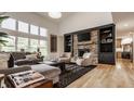 Cozy living room featuring a stone fireplace, built-in shelving, and comfortable seating area at 1820 N 1100 E, Sheridan, IN 46069