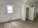 Bright living room featuring neutral walls, wooden floors, and a window for light at 243 Iowa St, Indianapolis, IN 46225