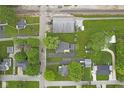 Overhead view of property, including a well-kept lawn, garage, and surrounding neighborhood at 30 N Depot St, New Palestine, IN 46163