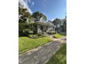 Lovely home with a welcoming front porch and beautifully landscaped surroundings at 303 Walnut St, Greenfield, IN 46140