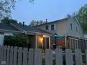 Townhouse backyard with wooden privacy fence, patio dining set, and manicured garden at 3984 Braddock Rd, Indianapolis, IN 46268