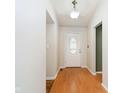 Inviting entryway with a decorative glass door and hardwood floors at 5240 Ochs Ave, Indianapolis, IN 46254