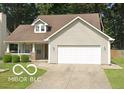 Charming single-Gathering home with a well-manicured lawn and a two-car attached garage at 5240 Ochs Ave, Indianapolis, IN 46254