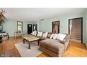 Inviting living room featuring hardwood floors, comfortable seating, and abundant natural light at 5253 W 8Th Street Rd, Anderson, IN 46011