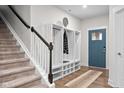 Inviting foyer featuring a coat rack with bench and a view of the front door at 5264 Veranda Dr, Noblesville, IN 46062