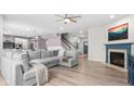 Spacious living room with a fireplace, open to the kitchen and dining area at 5264 Veranda Dr, Noblesville, IN 46062
