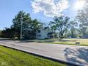 A view of a two-story home with a well-maintained lawn at 6336 N Carroll Rd, Indianapolis, IN 46235
