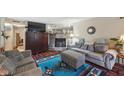 Cozy living room with a brick fireplace, comfortable seating, and stylish decor, perfect for Gathering gatherings at 9130 E 18Th St, Indianapolis, IN 46229