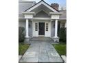 Close-up of the front door showing the columns and black door with sidelights at 9510 Copley Dr, Indianapolis, IN 46260