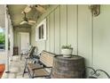 Cozy front porch featuring comfortable seating, ceiling fans, and decorative touches at 12920 N Oakhaven Dr, Camby, IN 46113