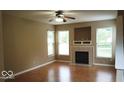 Cozy living room with a fireplace and hardwood floors at 14170 Royalwood Dr, Fishers, IN 46037