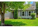 Charming home with mature trees, green lawn, and tasteful landscaping, offering pleasant curb appeal at 17841 Grassy Knoll Dr, Westfield, IN 46074