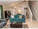 Open-concept living room featuring hardwood floors, neutral colors, and access to the second floor at 17841 Grassy Knoll Dr, Westfield, IN 46074