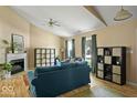 Bright and inviting living room with high ceilings, a fireplace, and a cozy seating area at 17841 Grassy Knoll Dr, Westfield, IN 46074