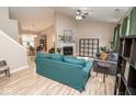 Bright and airy living room featuring vaulted ceilings, hardwood floors, and a cozy fireplace at 17841 Grassy Knoll Dr, Westfield, IN 46074