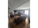 Cozy living room with plush furniture, a large TV, and ample natural light at 2248 Salem Park Dr, Indianapolis, IN 46239