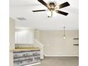 Bright living room with ceiling fan, neutral walls, open space, and stylish decor at 2306 Brightwell Pl, Indianapolis, IN 46260