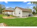 Spacious backyard featuring a covered patio perfect for outdoor entertaining at 2414 N Blaine St, Muncie, IN 47303