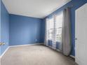 Cozy bedroom features a soft carpet, fresh paint, and great natural light at 2502 Creekland Dr, Columbus, IN 47201