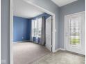 Bright and airy living room features fresh paint and modern flooring at 2502 Creekland Dr, Columbus, IN 47201
