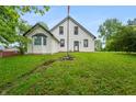 Charming home with green lawn, bay window, and visible foundation, offering a unique view at 5312 E Southern Ave, Indianapolis, IN 46203