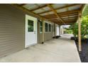A spacious back porch featuring a metal roof and access to the house at 5422 Orange St, Indianapolis, IN 46203