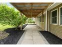 A cozy back porch featuring a metal roof and stone flooring at 5422 Orange St, Indianapolis, IN 46203